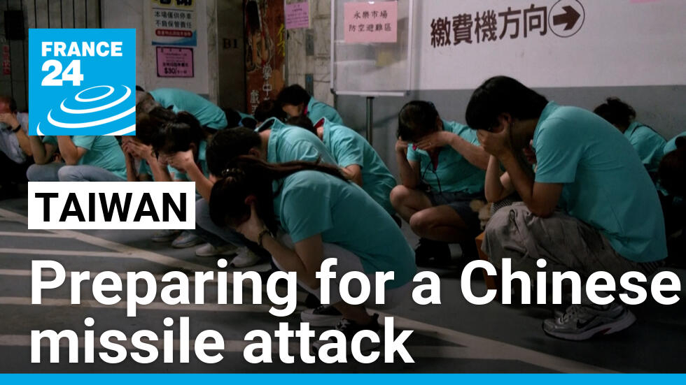 People take shelter as part of civil defence drills in Taipei, Taiwan, on July 23, 2024.